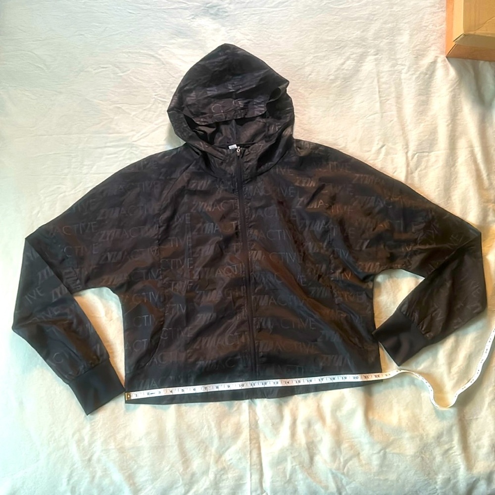 Hooded Zyia light running jacket with cinching bottom band and on hood